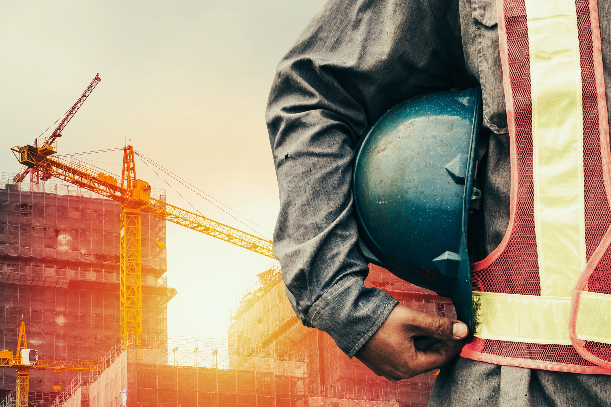 Construction Worker Holding Hardhat
